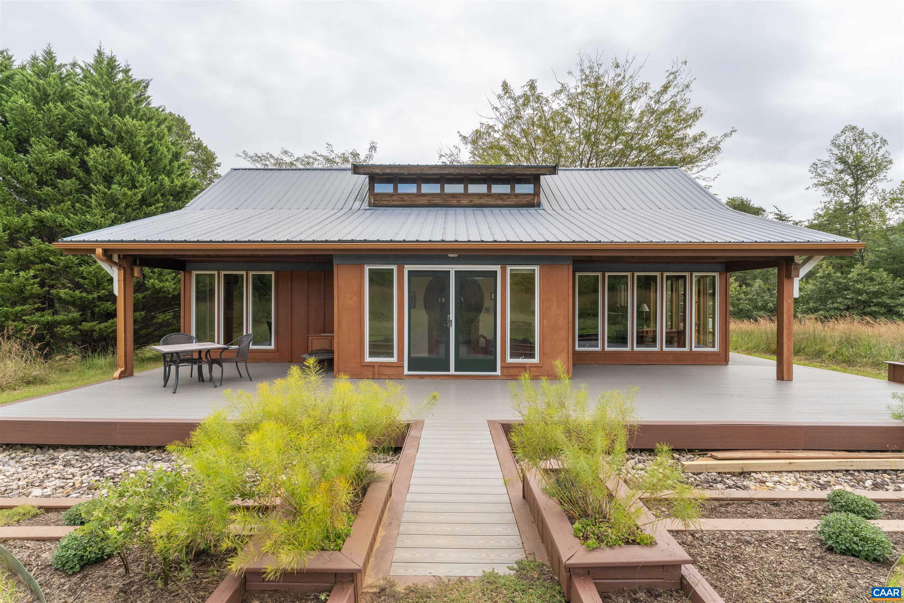 787 Durrett Town Road Afton, VA 22920 - Photo 2 of 49 a front view of a house with sitting area and garden