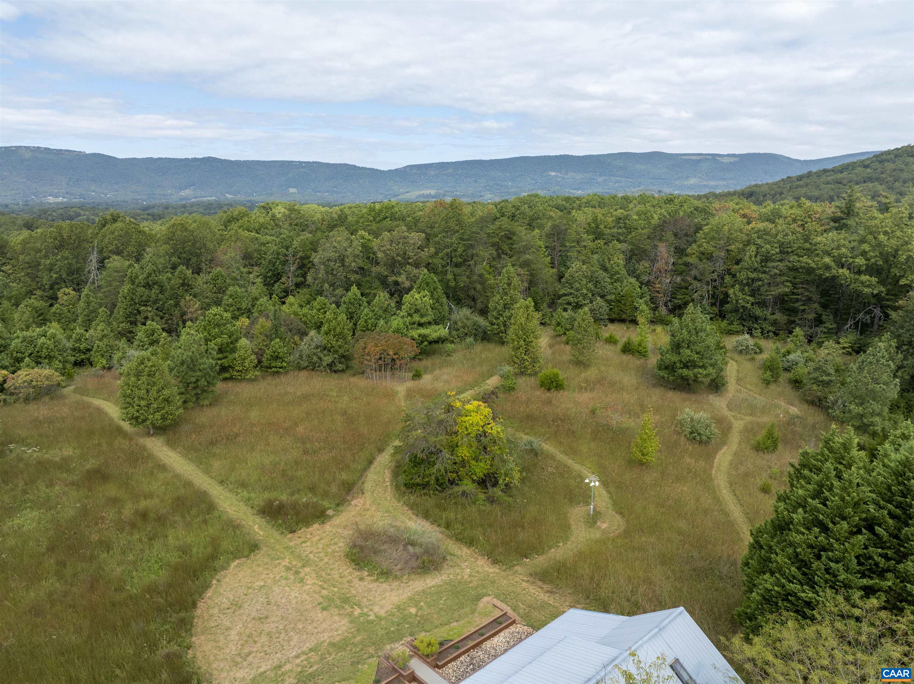 787 Durrett Town Road Afton, VA 22920 - Photo 21 of 49 a view of a lake with a mountain in the background