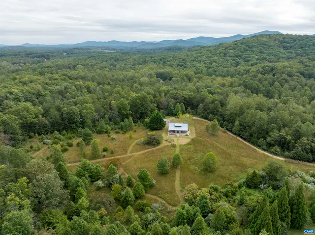 a view of a field with an trees