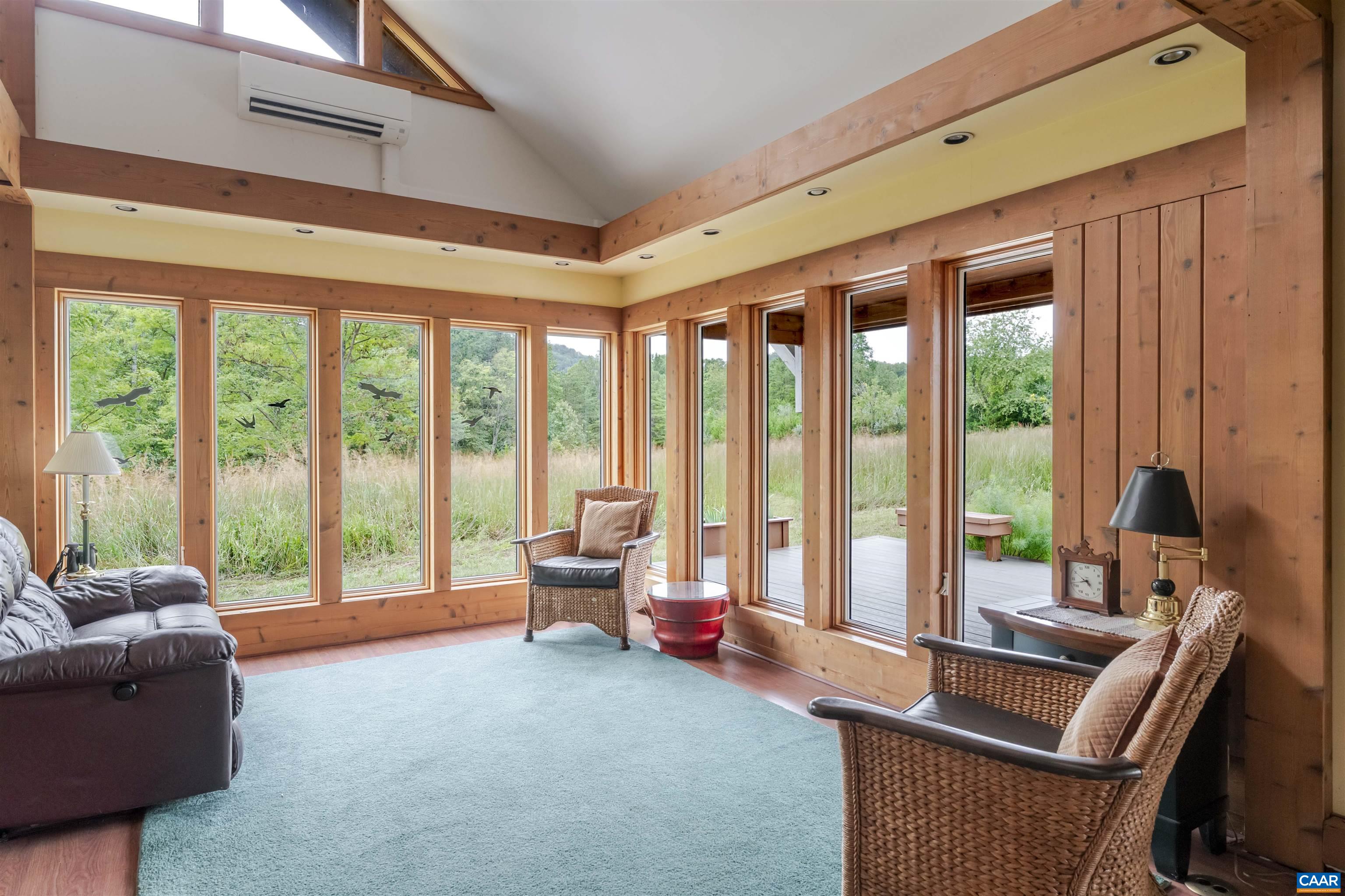 787 Durrett Town Road Afton, VA 22920 - Photo 25 of 49 a living room with furniture and large windows