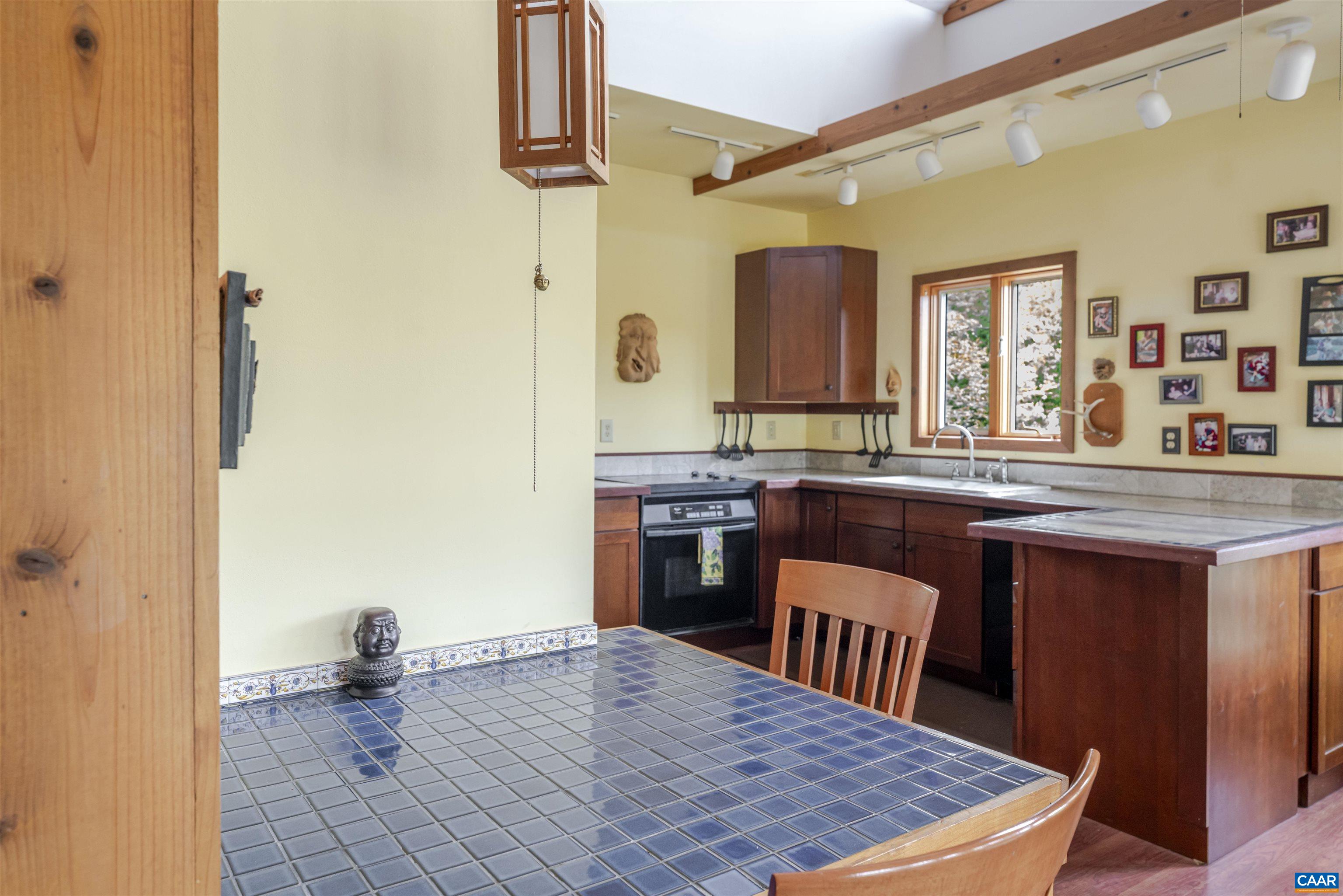 787 Durrett Town Road Afton, VA 22920 - Photo 27 of 49 a kitchen with stainless steel appliances granite countertop a stove a sink and a refrigerator
