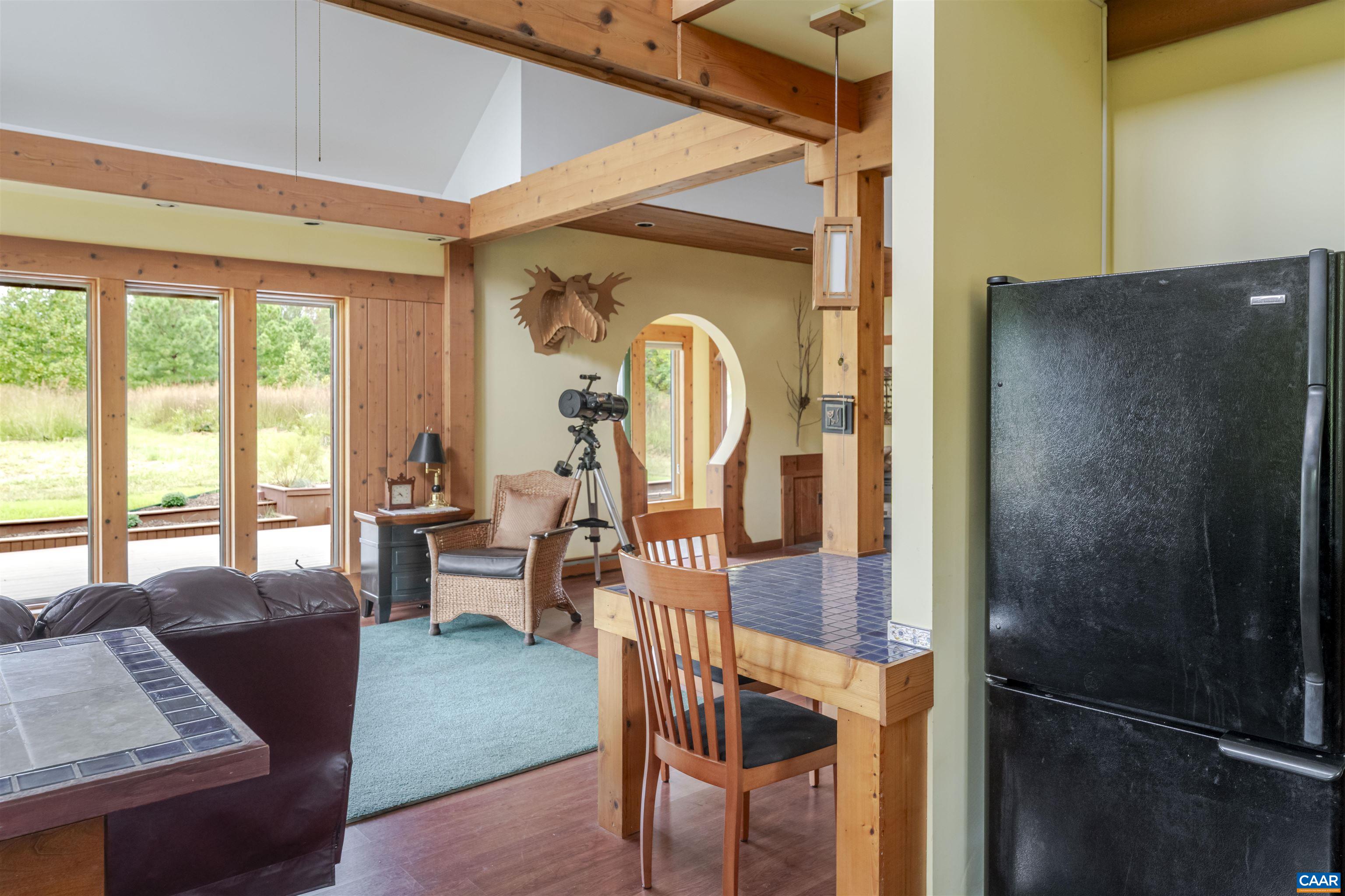787 Durrett Town Road Afton, VA 22920 - Photo 30 of 49 a view of living room and dining room with furniture window and wooden floor