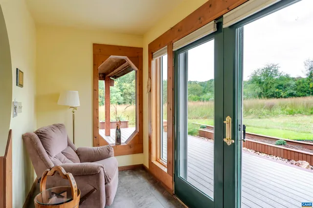 a room with furniture and a large window