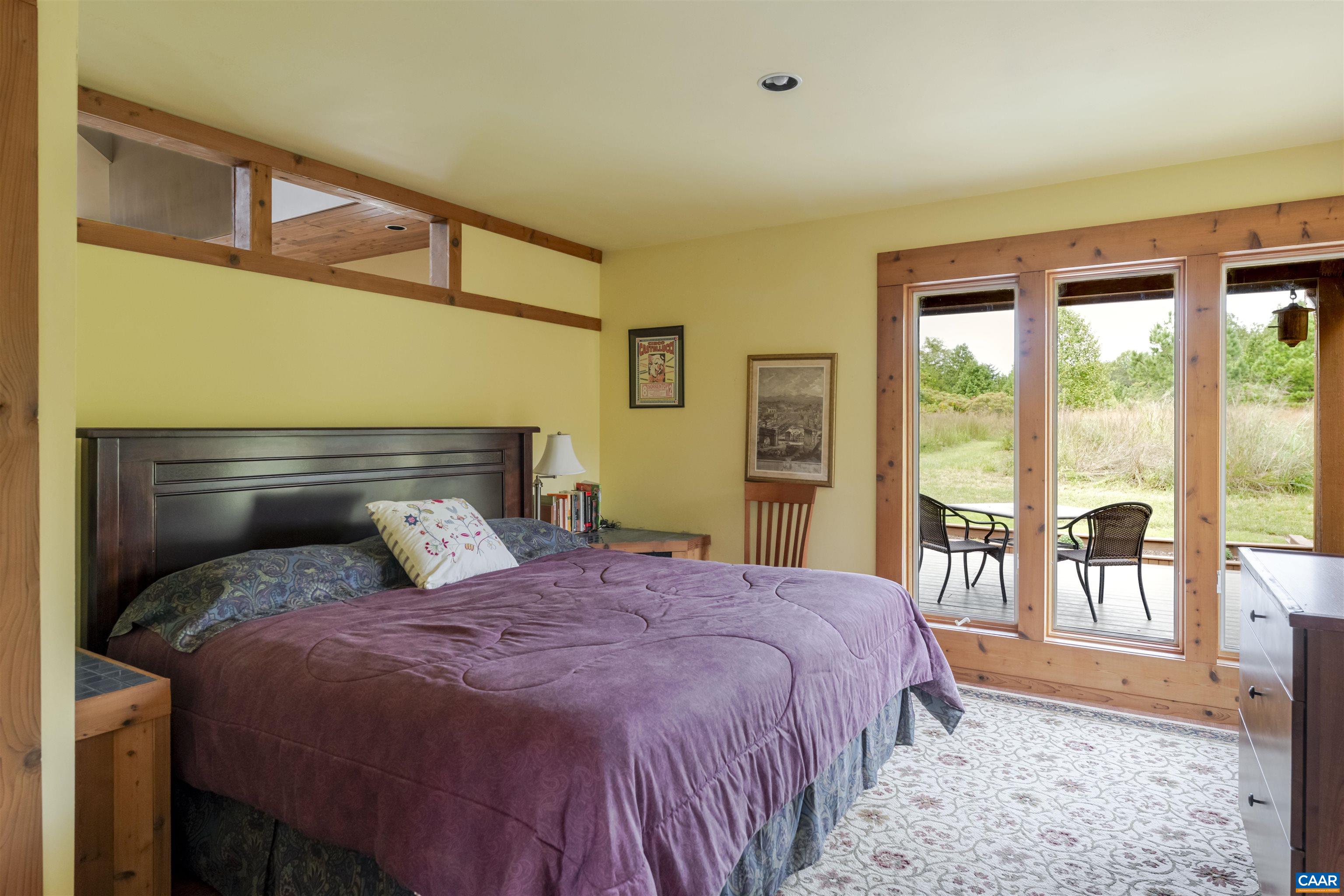 787 Durrett Town Road Afton, VA 22920 - Photo 34 of 49 a bedroom with a large bed and a large window