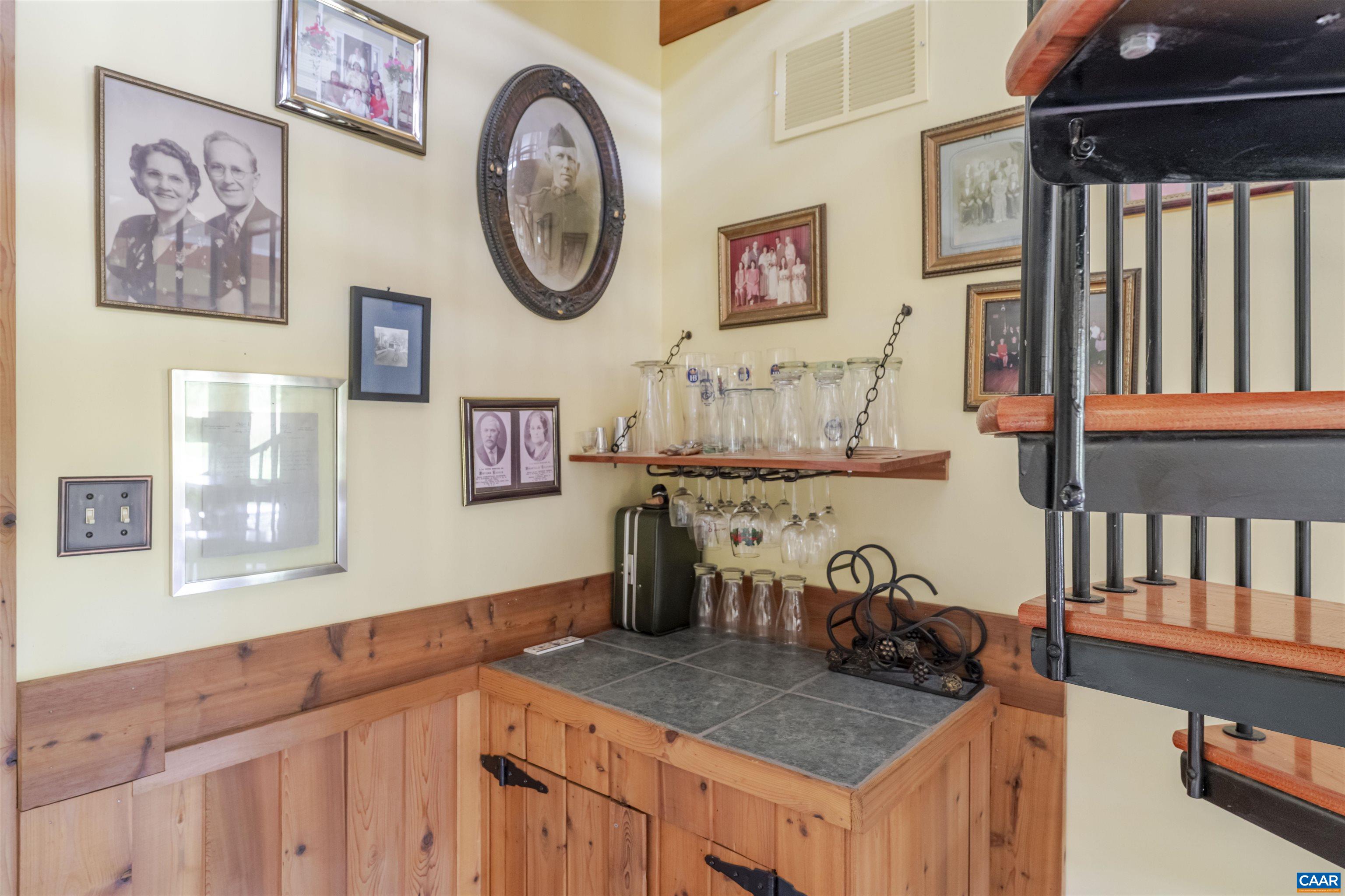 787 Durrett Town Road Afton, VA 22920 - Photo 37 of 49 a bathroom with a granite countertop sink and a mirror