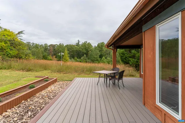 a view of a lake with chairs