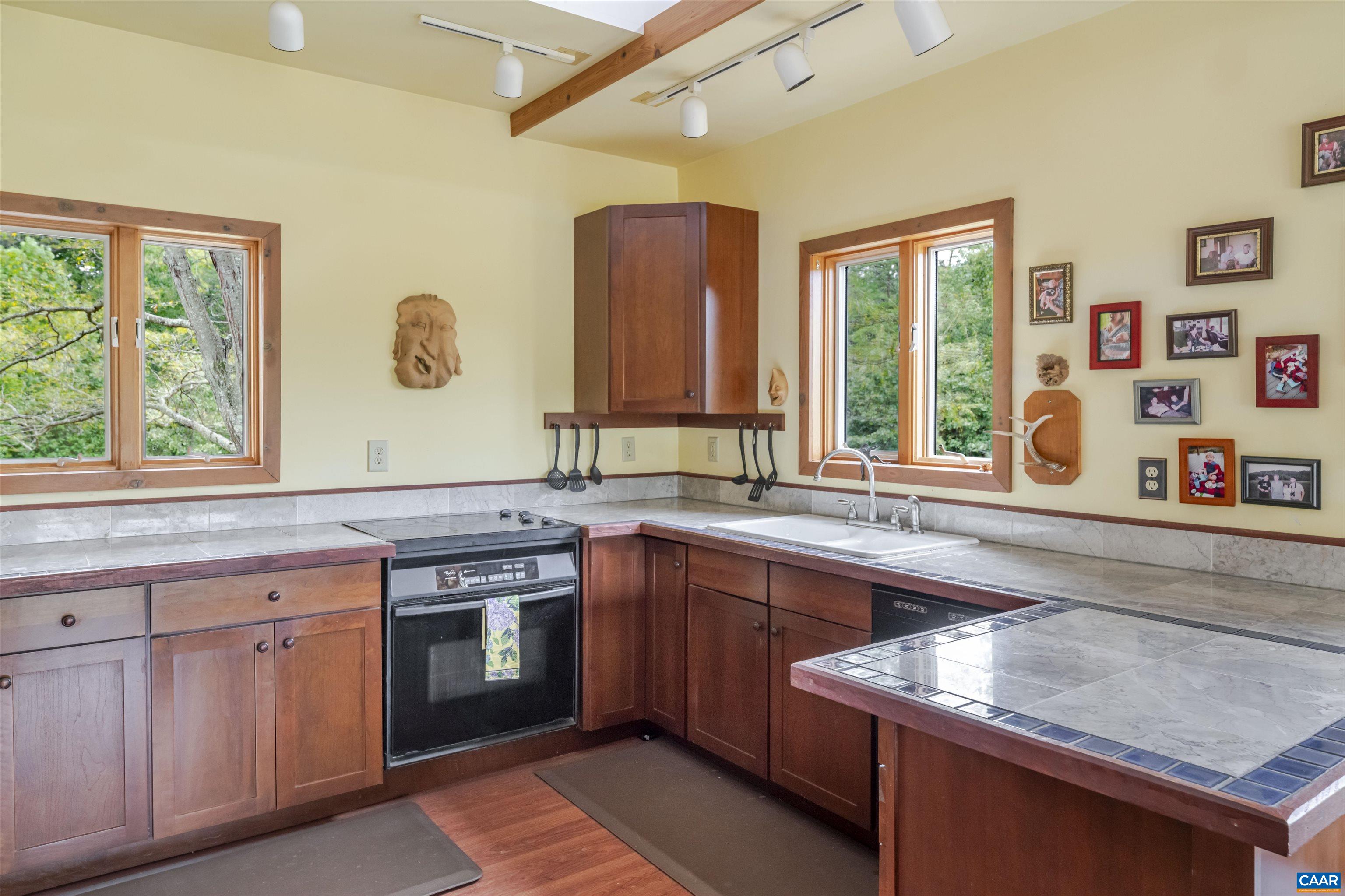 787 Durrett Town Road Afton, VA 22920 - Photo 8 of 49 a kitchen with a sink stove and cabinets