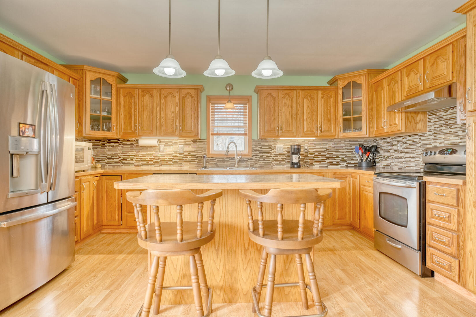 6900 North 600 West Rensselaer, IN 47978 - Photo 3 of 15 a view of a kitchen with granite countertop a sink and a stove