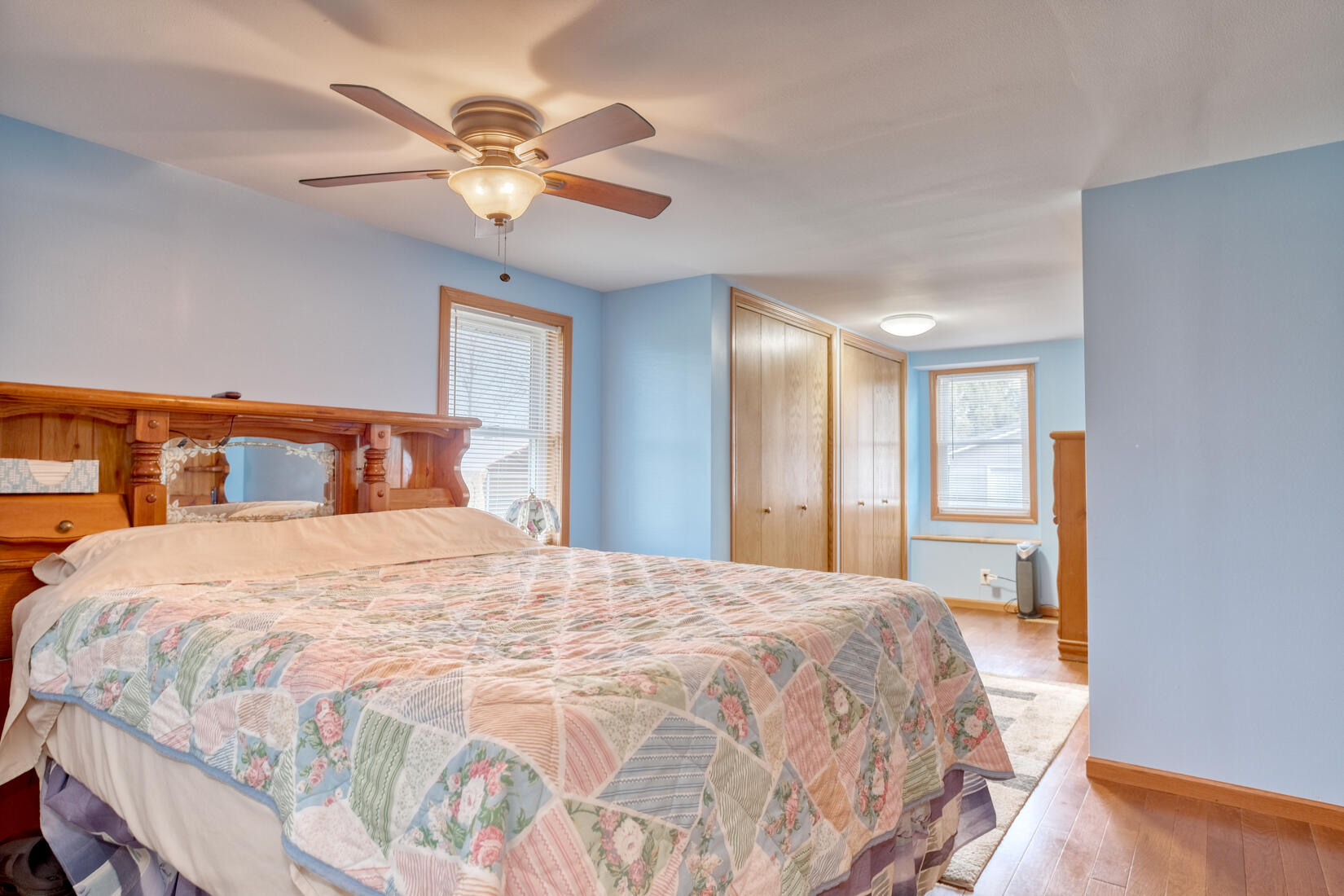 6900 North 600 West Rensselaer, IN 47978 - Photo 7 of 15 a bedroom with a large bed and a ceiling fan