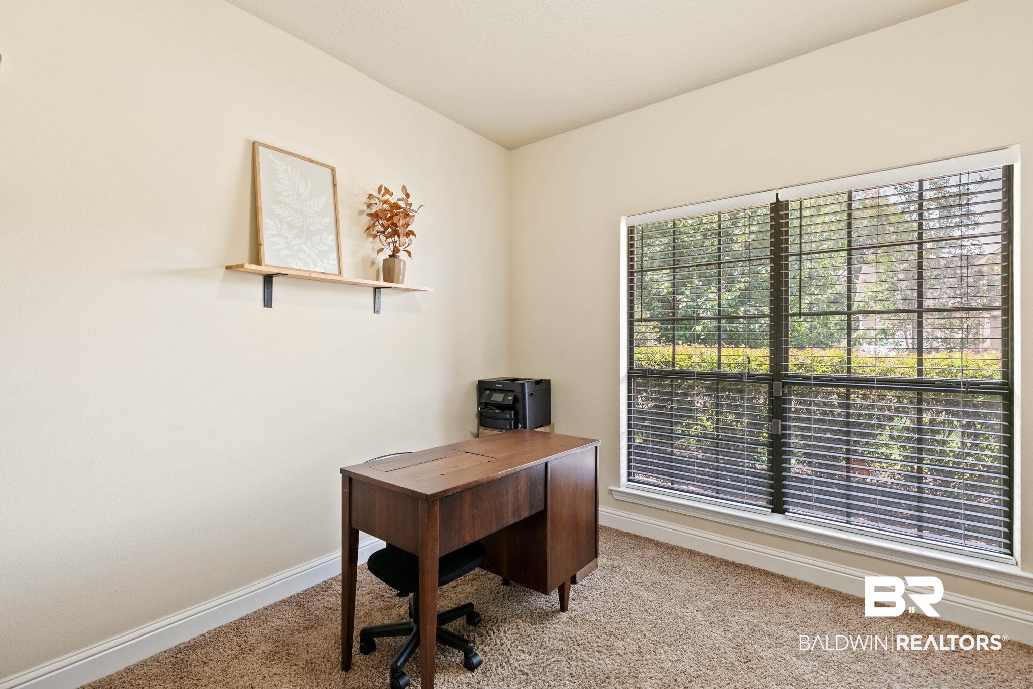 2216 Livingstone Court Mobile, AL 36695 - Photo 30 of 62 Bright room featuring a large window with horizontal blinds, neutral wall paint, white baseboards, and carpet flooring