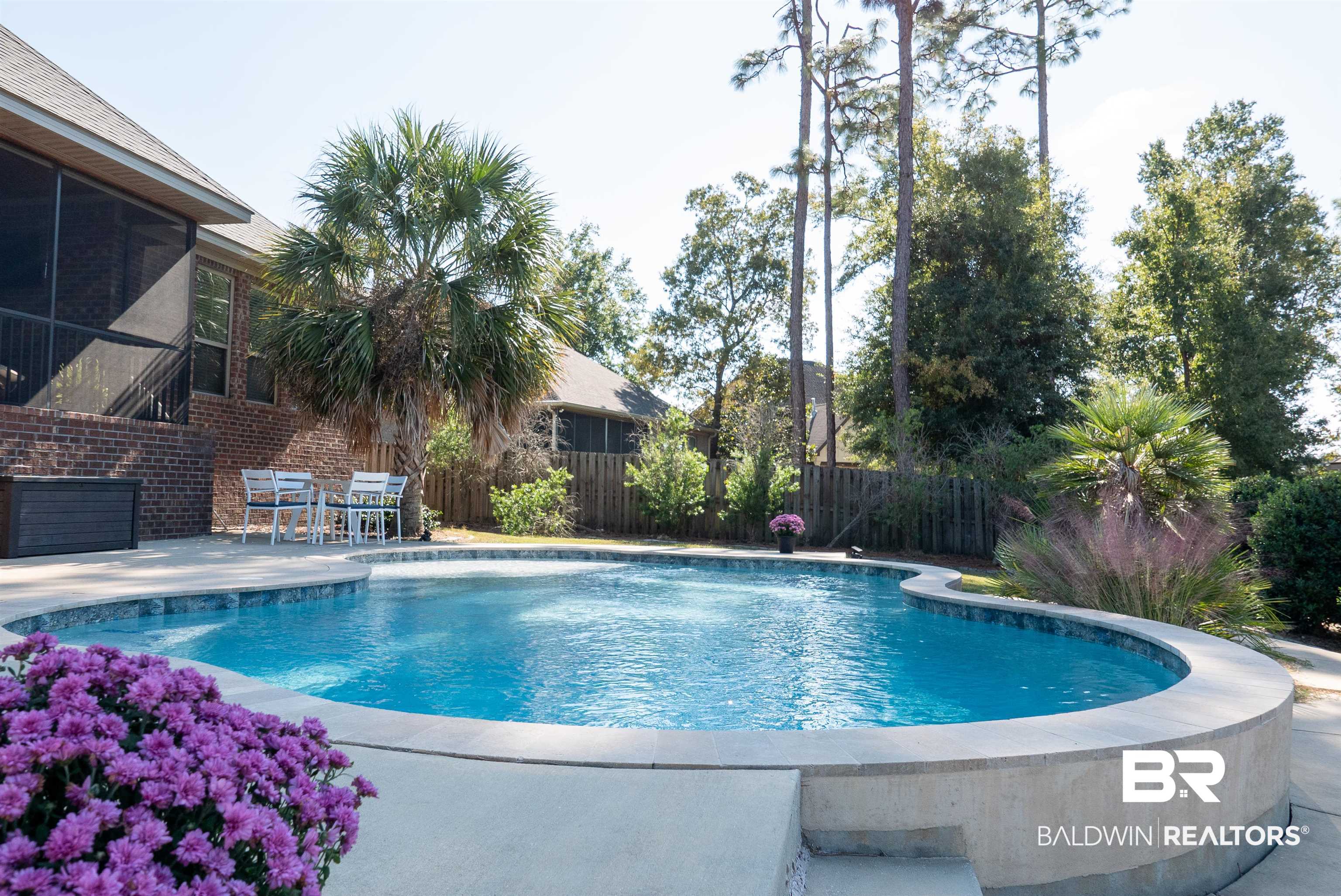 6684 Garrison Drive Daphne, AL 36527 - Photo 2 of 35 View of swimming pool featuring a patio area and a sunroom