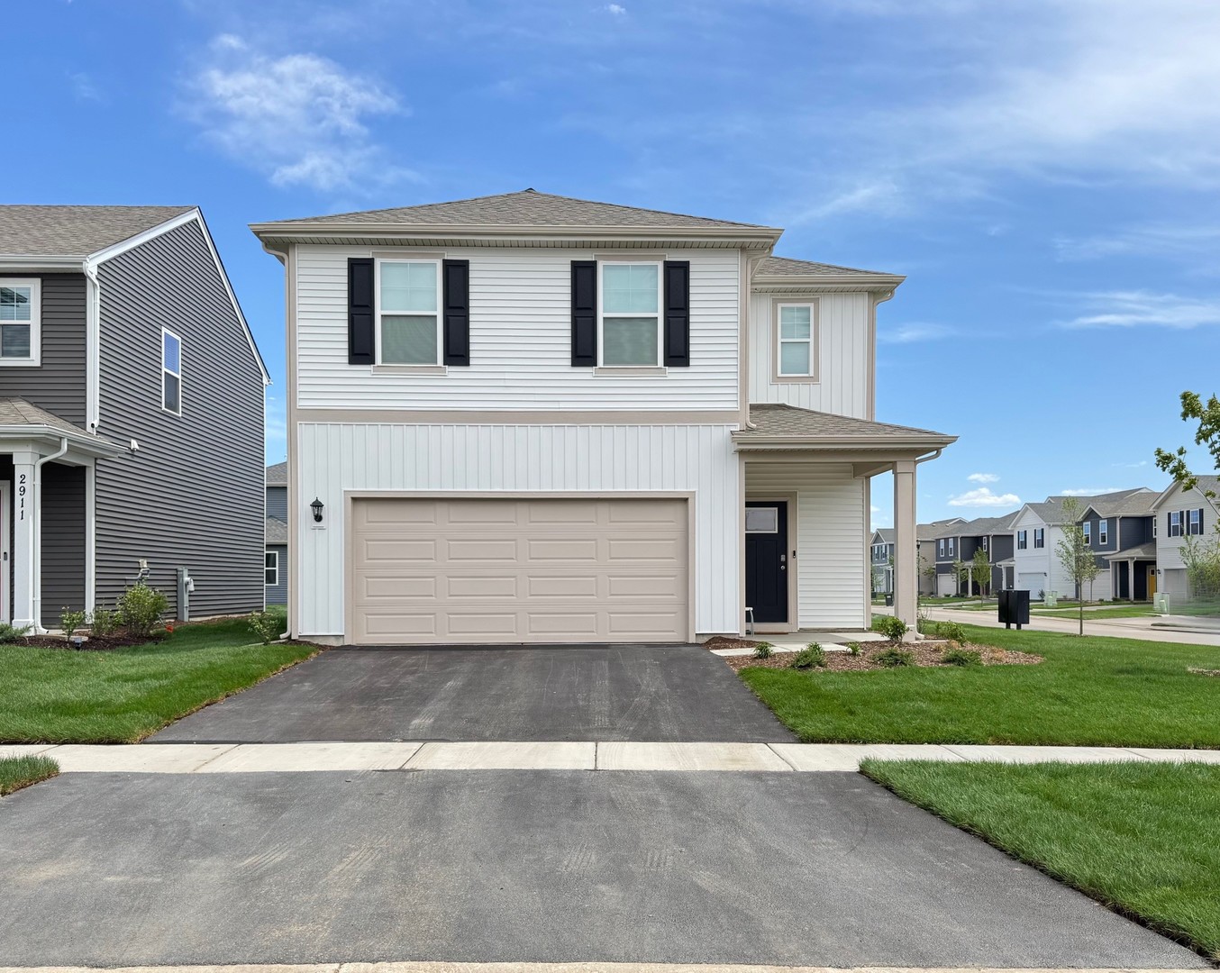 1241 Acadia Circle Pingree Grove, IL 60140 - Photo 1 of 43 a front view of a house with a yard and garage