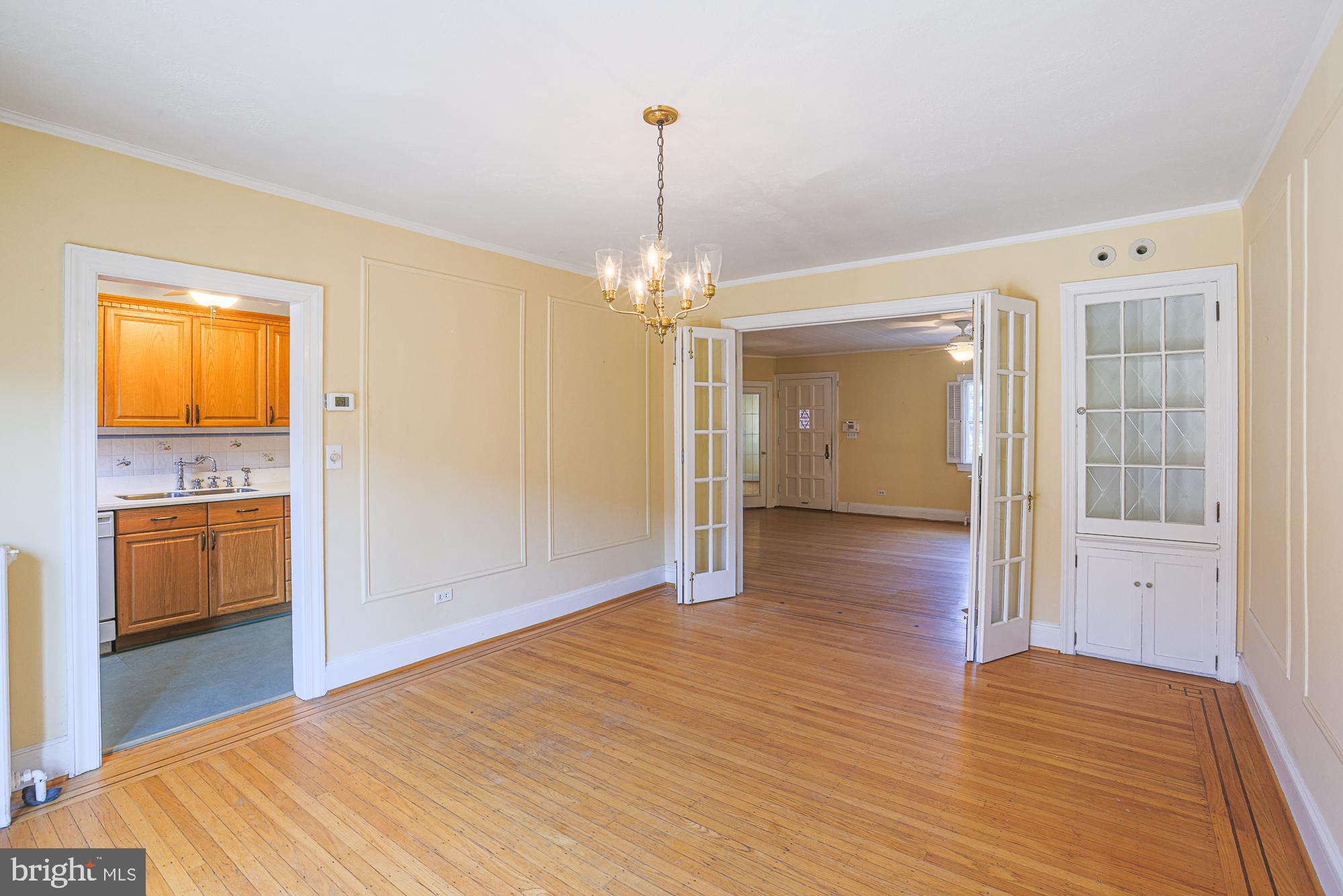 3710 Rexmere Road Baltimore, MD 21218 - Photo 14 of 57 Dining Room with original French doors and cabinet