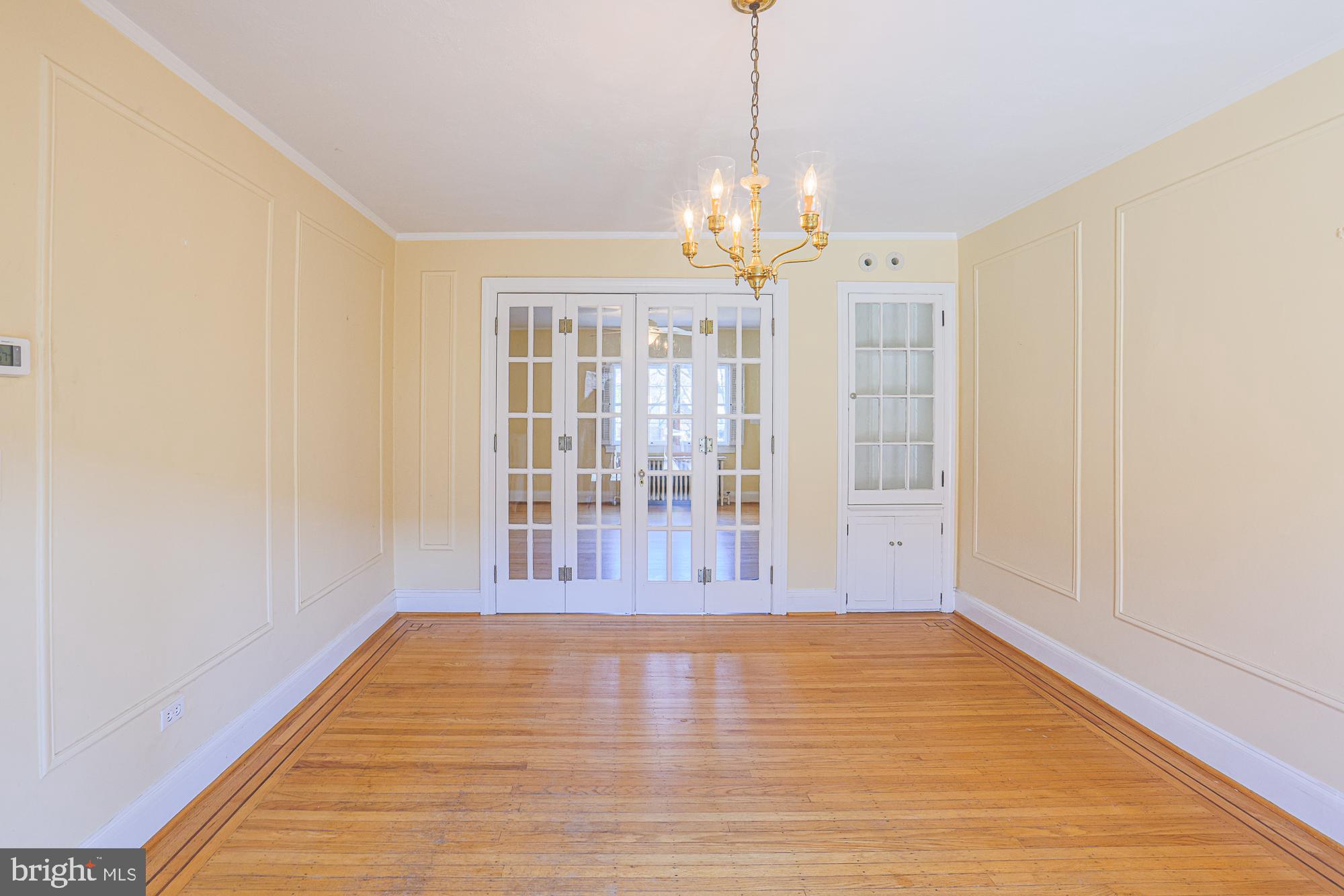 3710 Rexmere Road Baltimore, MD 21218 - Photo 16 of 57 Dining Room with original French doors and cabinet