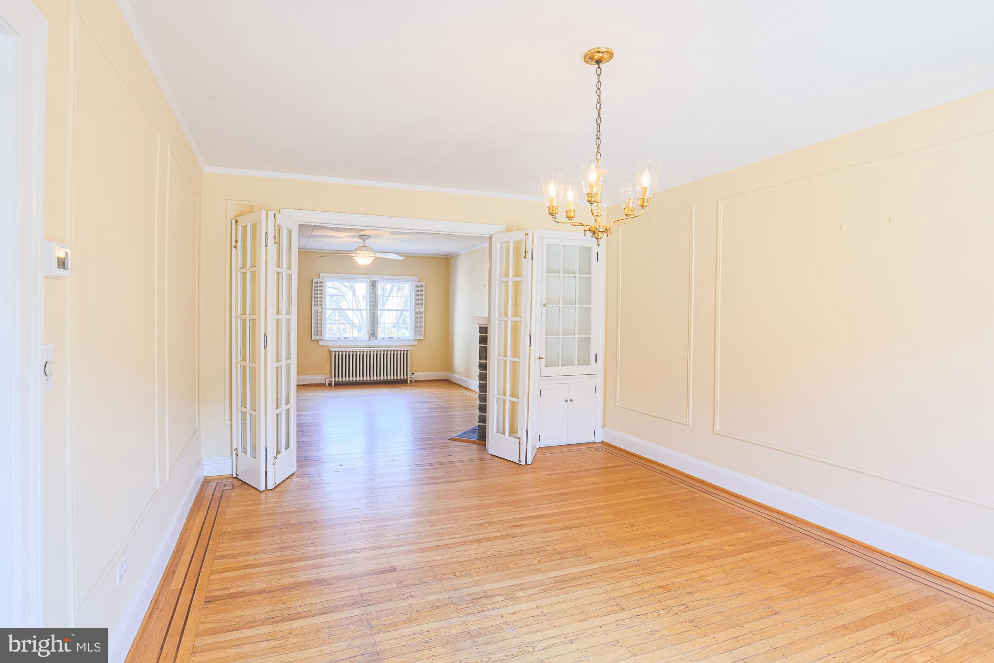 3710 Rexmere Road Baltimore, MD 21218 - Photo 17 of 57 Dining Room with original French doors and cabinet