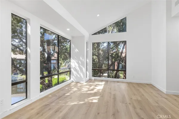 a view of an entryway with wooden floor