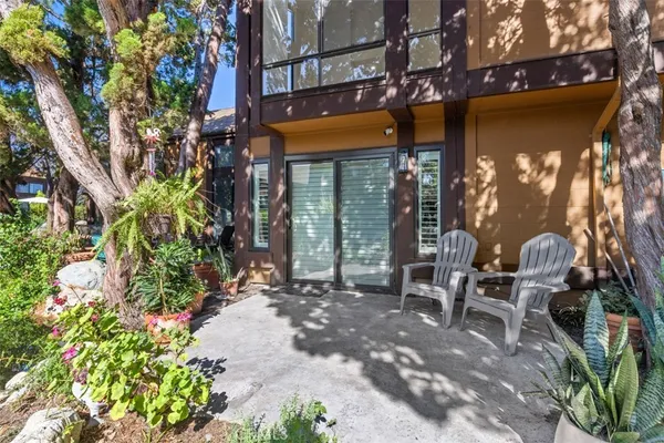 a wooden bench sitting in front of a building