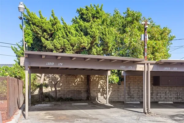 front view of a house with a tree