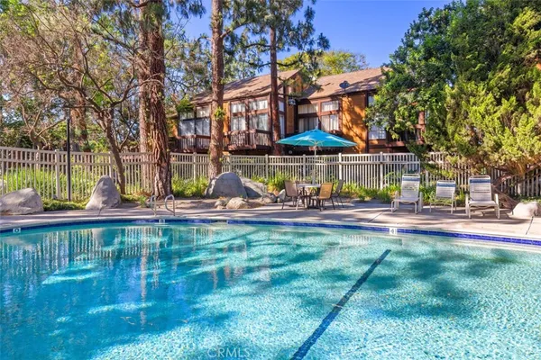 a small pool with a yard and a fountain