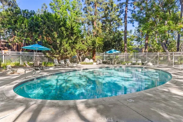 a view of a swimming pool with a patio