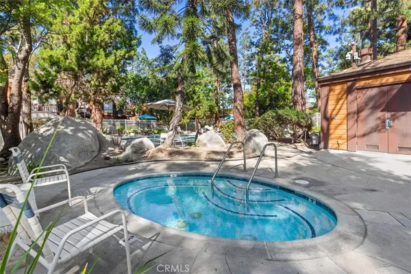 a view of a swimming pool with a patio