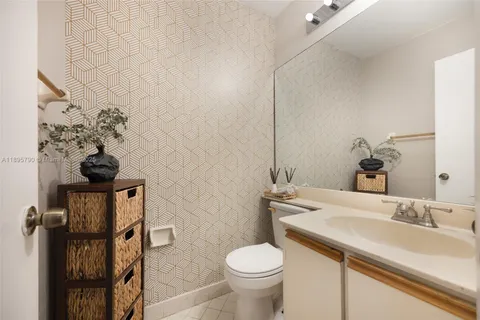 a bathroom with a sink toilet and vanity