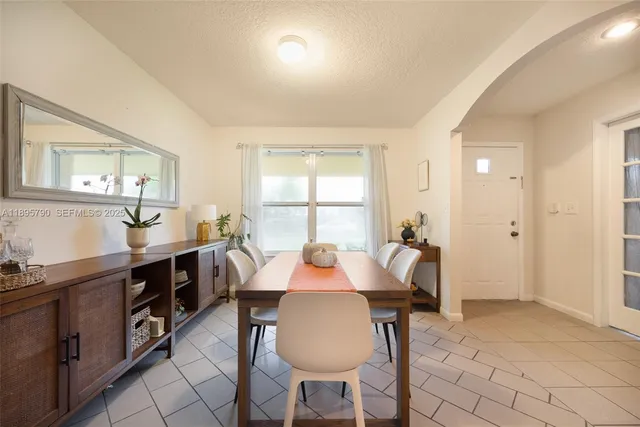 a view of a dining room with furniture and window
