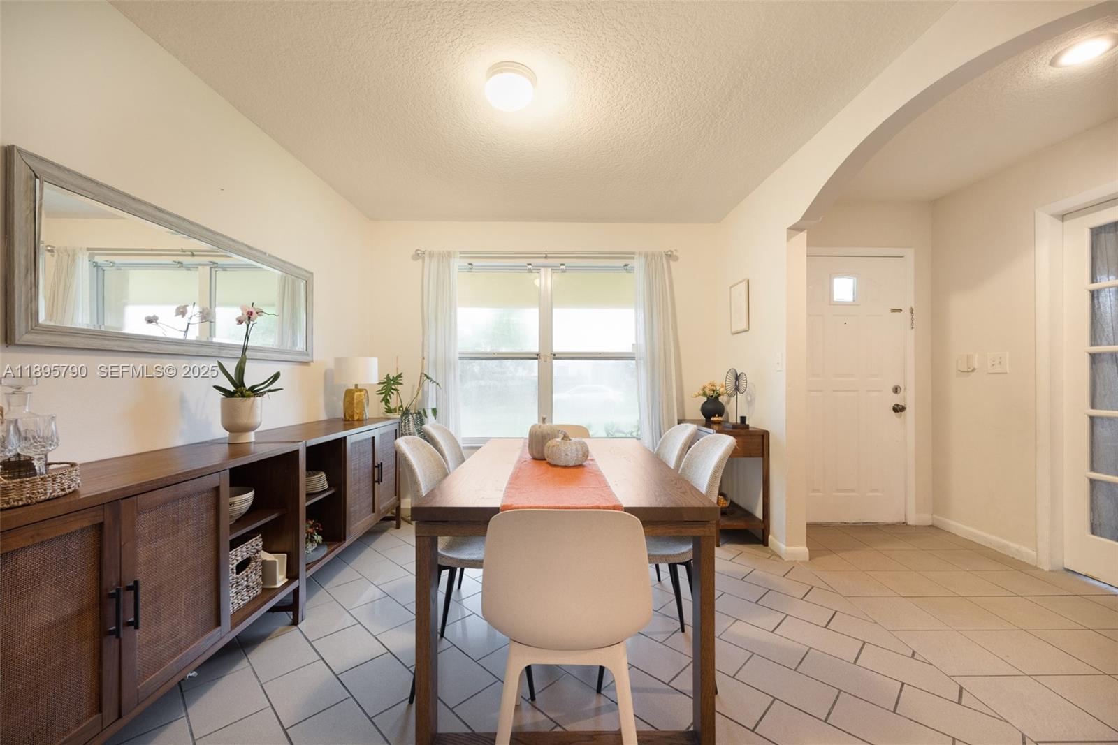 9730 Southwest 219th Street Cutler Bay, FL 33190 - Photo 7 of 25 a view of a dining room with furniture and window