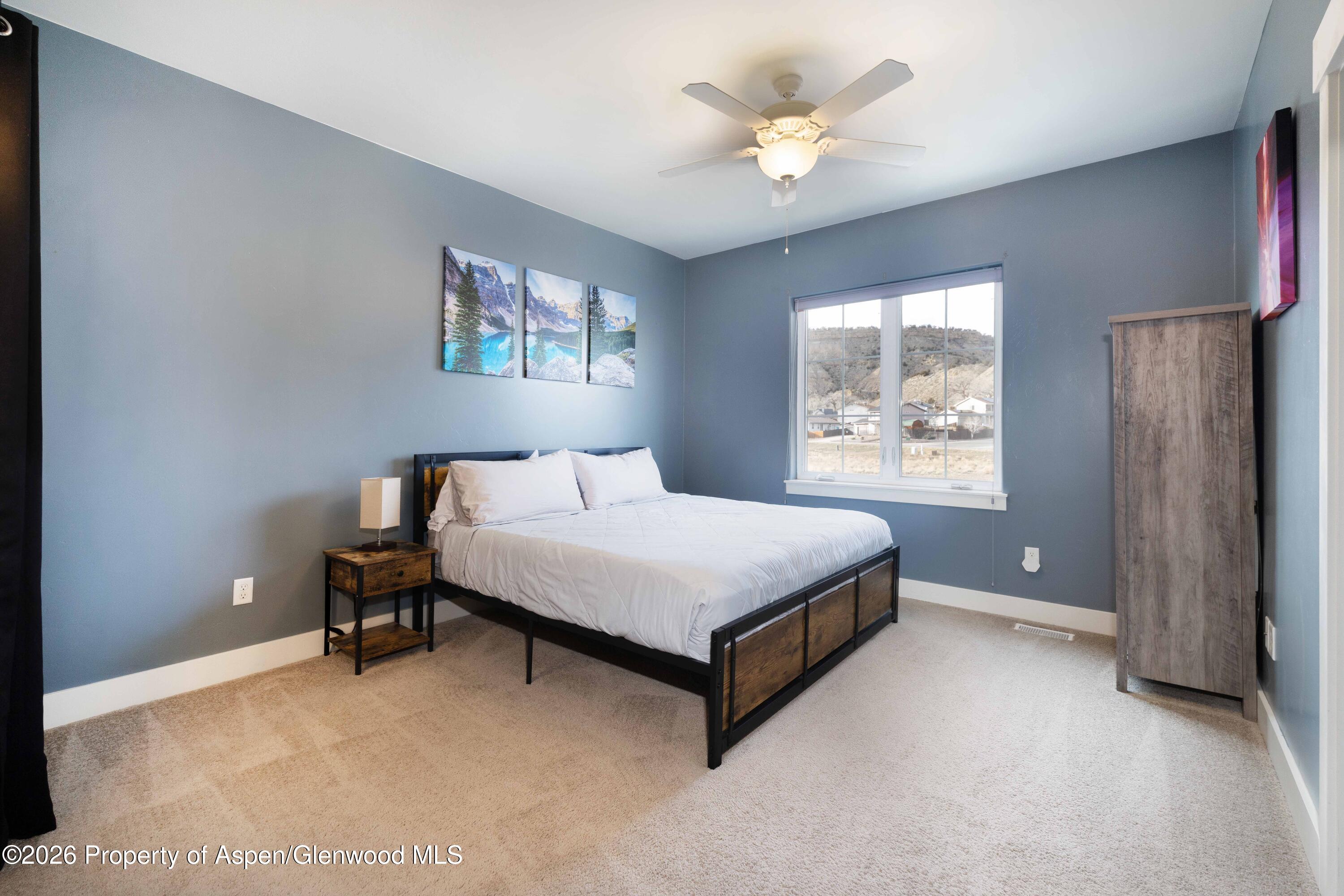 860 West 24th Street Rifle, CO 81650 - Photo 11 of 12 a bedroom with a bed and a window