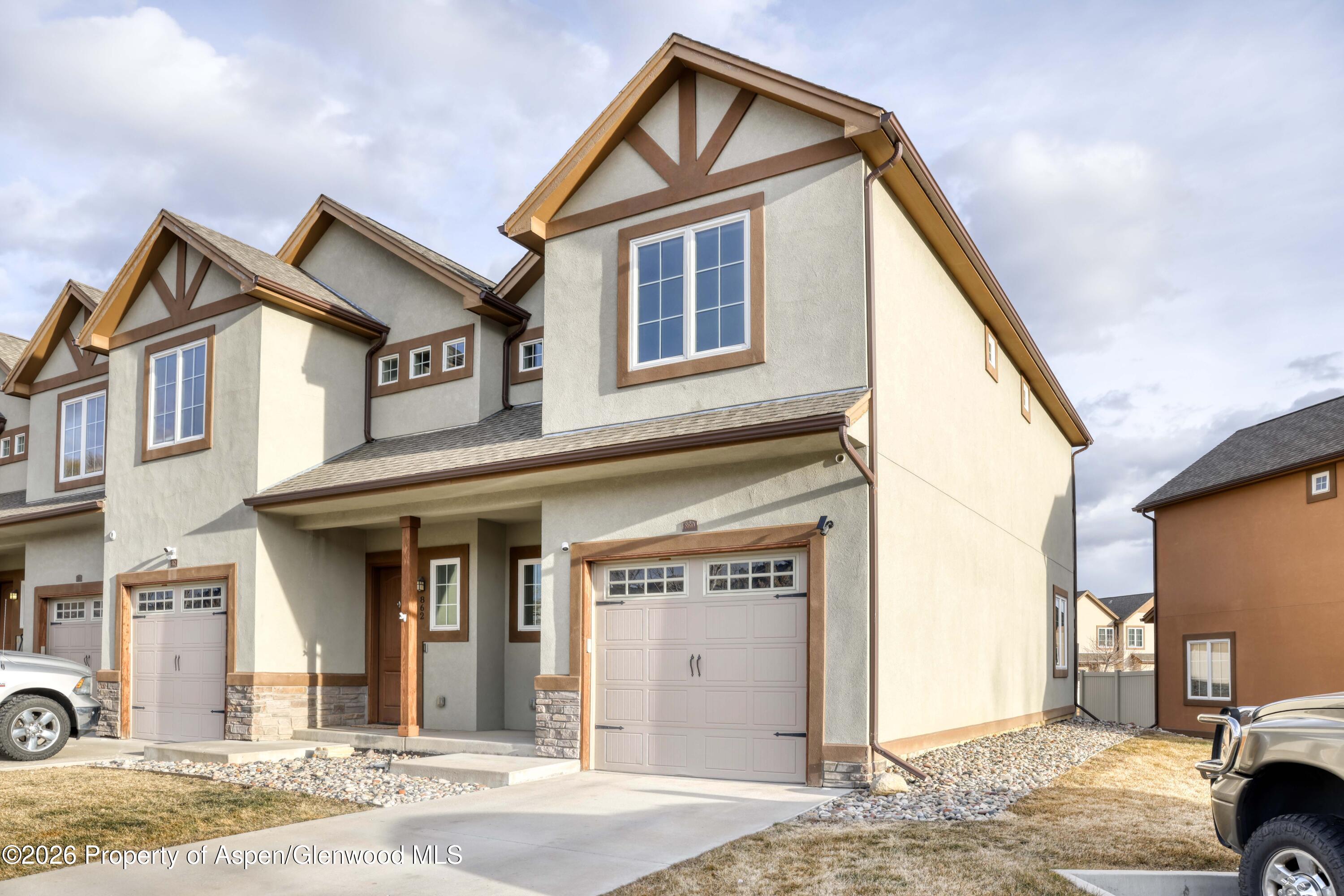 860 West 24th Street Rifle, CO 81650 - Photo 2 of 12 a front view of a house with parking space