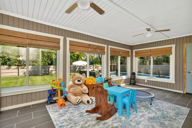 a view of a patio with a dining table and chairs