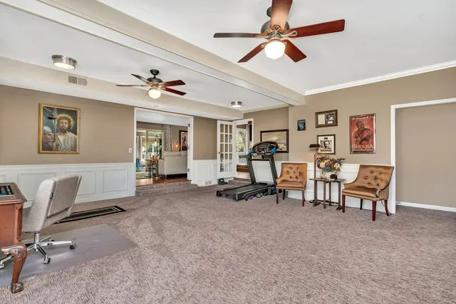 a view of a livingroom with furniture and a work place