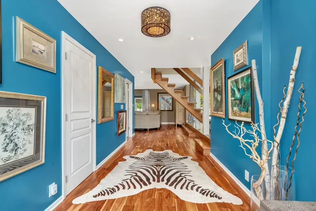 a view of an entryway with wooden floor