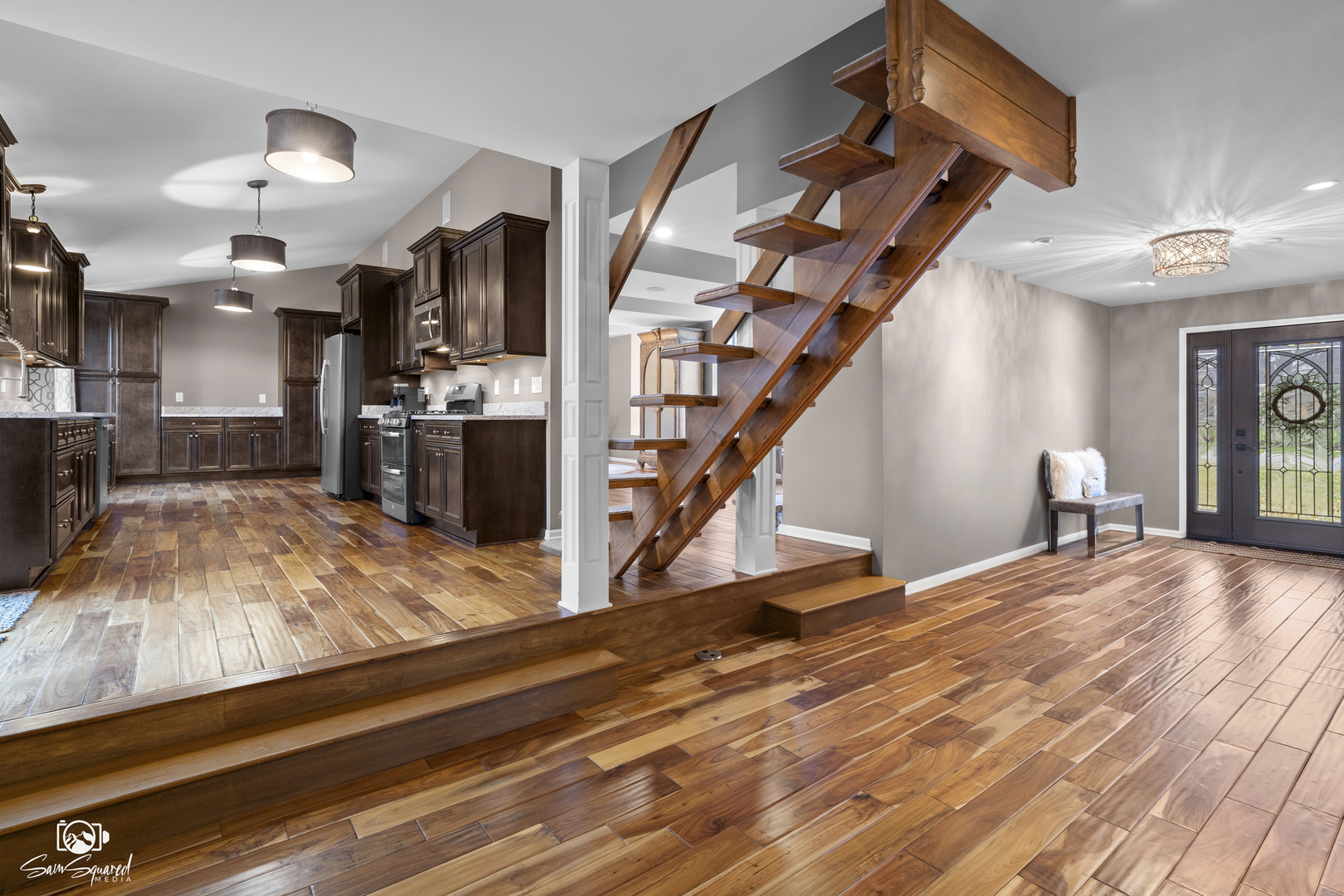 3509 Green Meadow Lane Joliet, IL 60431 - Photo 23 of 44 a view of a livingroom with furniture a bedroom and wooden floor