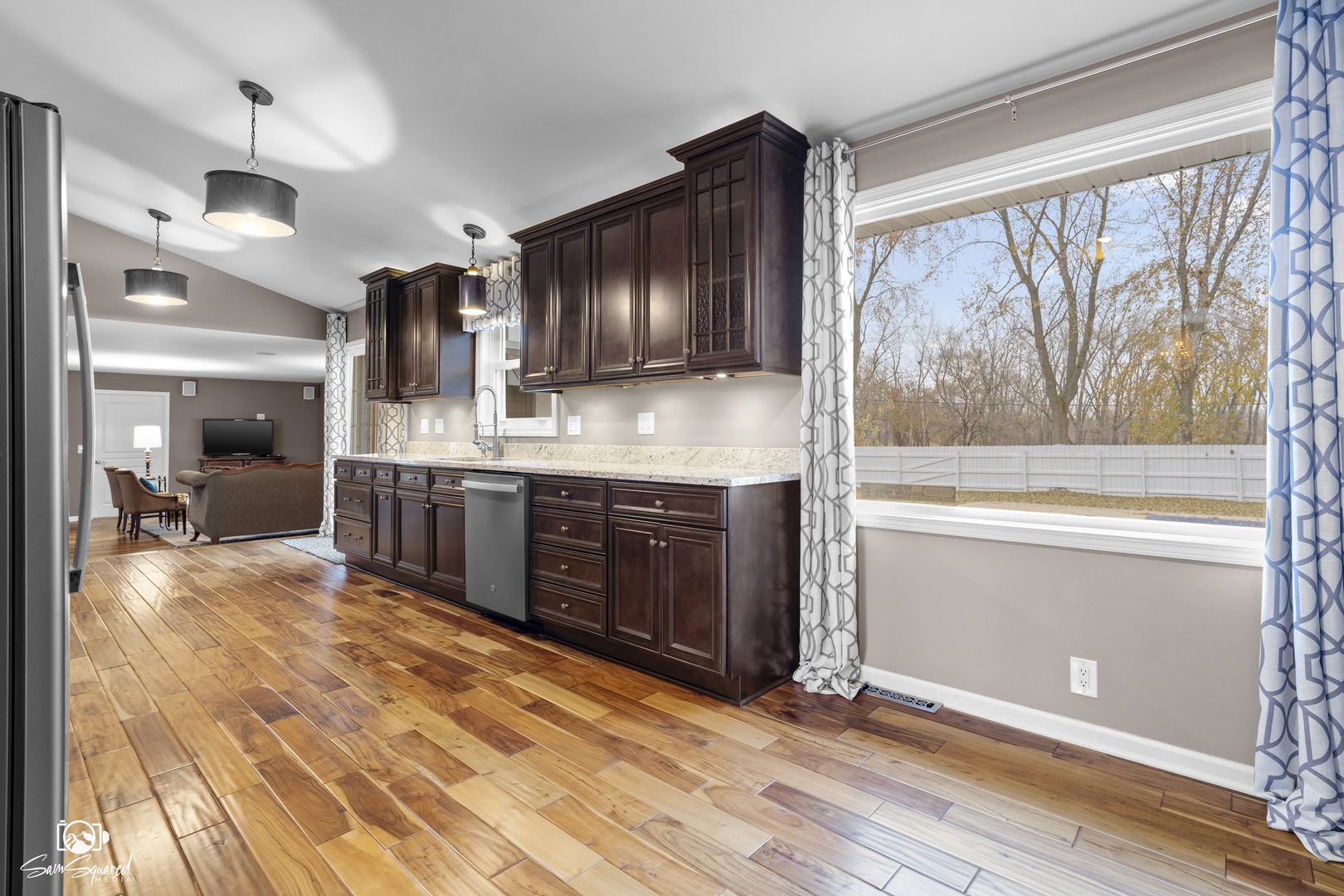 3509 Green Meadow Lane Joliet, IL 60431 - Photo 25 of 44 a large kitchen with stainless steel appliances wooden floor and a large window
