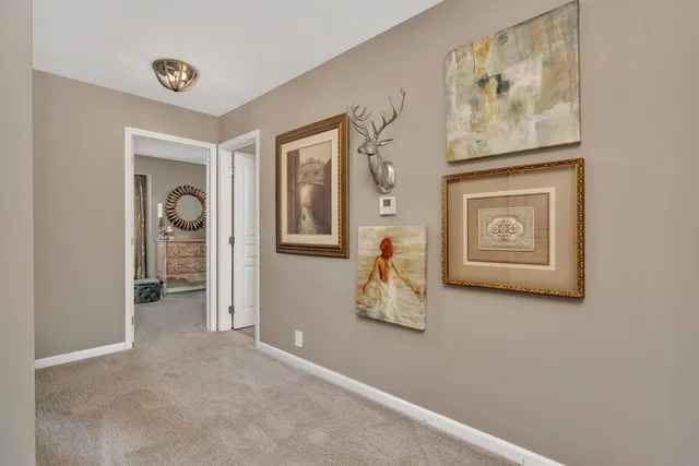a view of a livingroom with wooden floor and a window