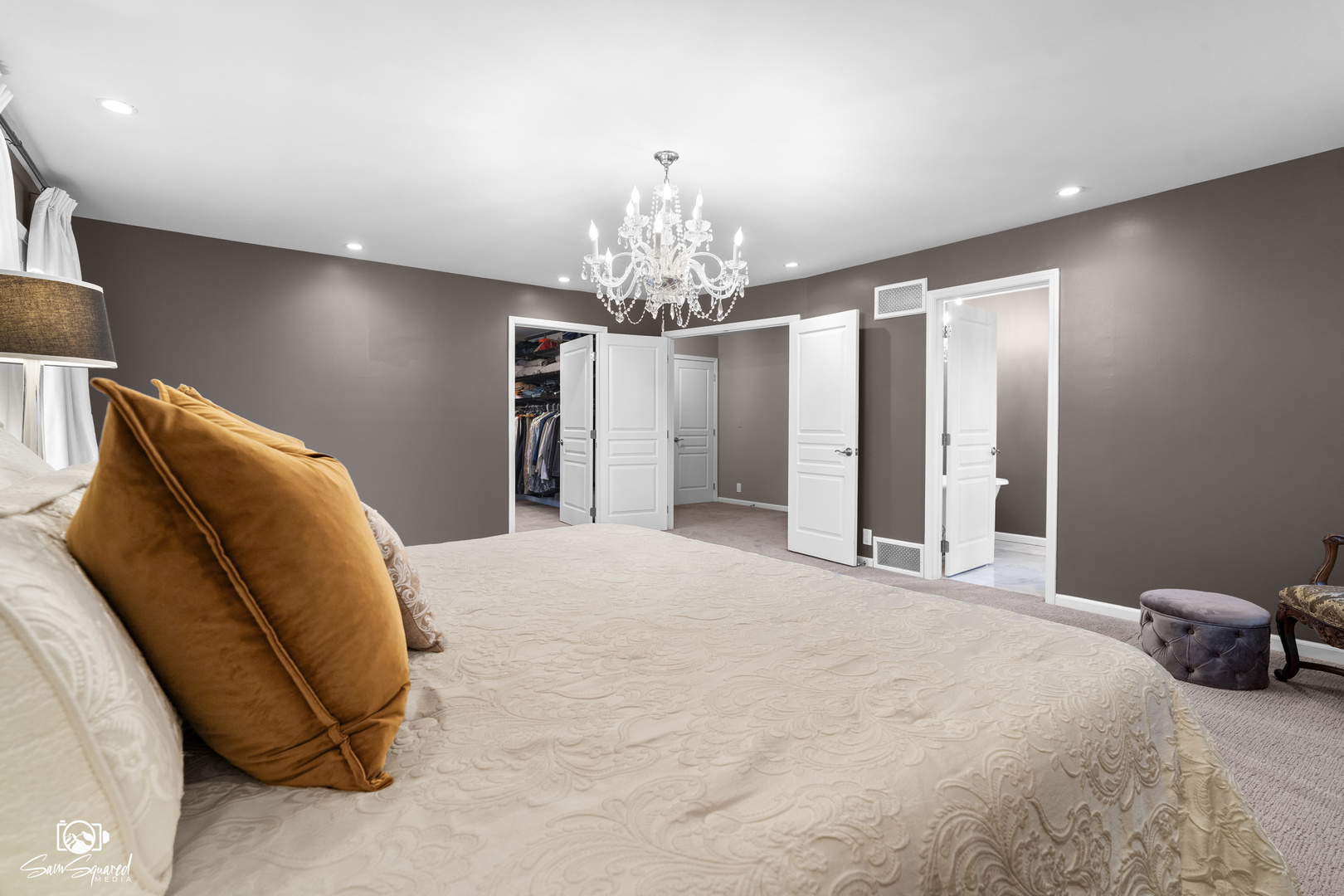 3509 Green Meadow Lane Joliet, IL 60431 - Photo 34 of 44 a bedroom with a bed and a chandelier