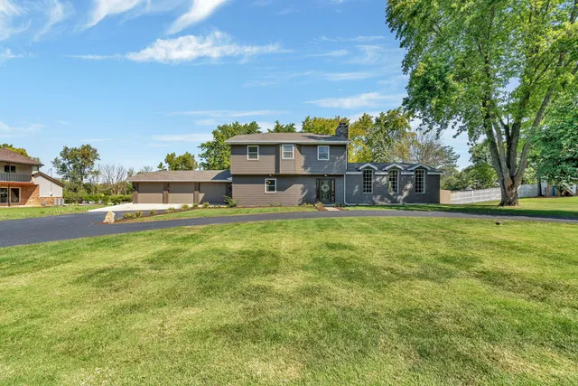 a view of a house with a big yard