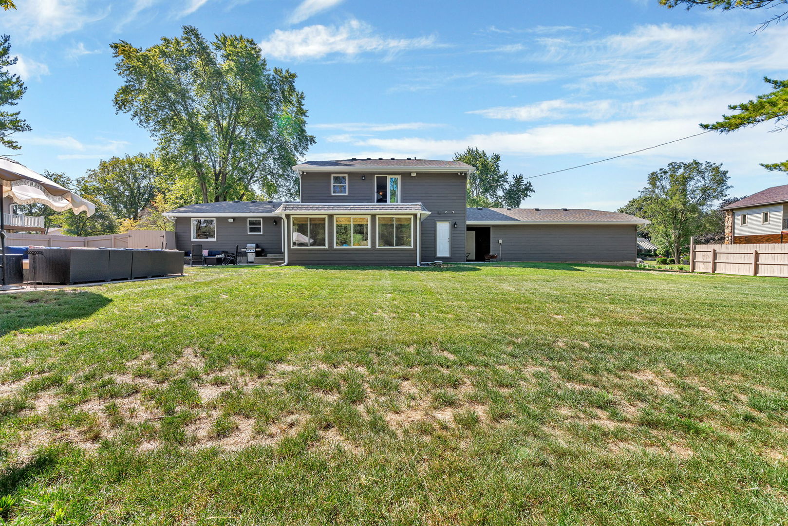 3509 Green Meadow Lane Joliet, IL 60431 - Photo 5 of 44 a view of a house with a big yard and potted plants