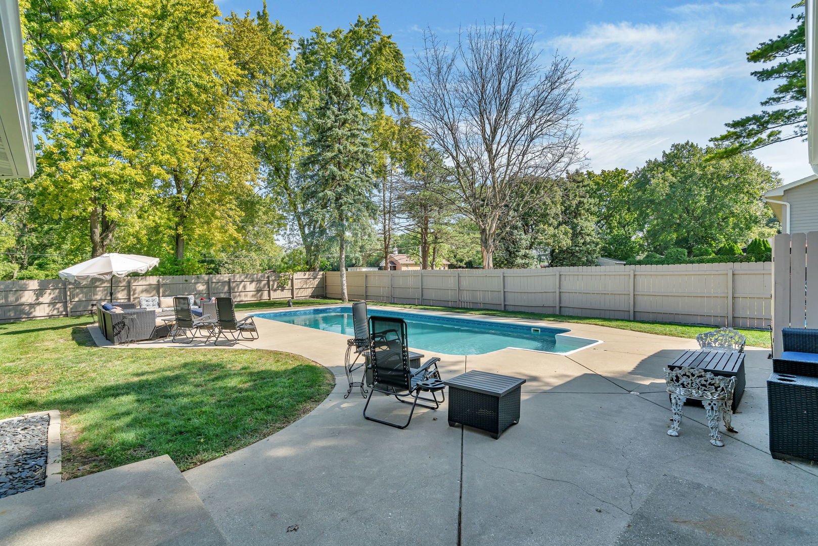 3509 Green Meadow Lane Joliet, IL 60431 - Photo 8 of 44 a view of a backyard with lawn chairs and a fire pit