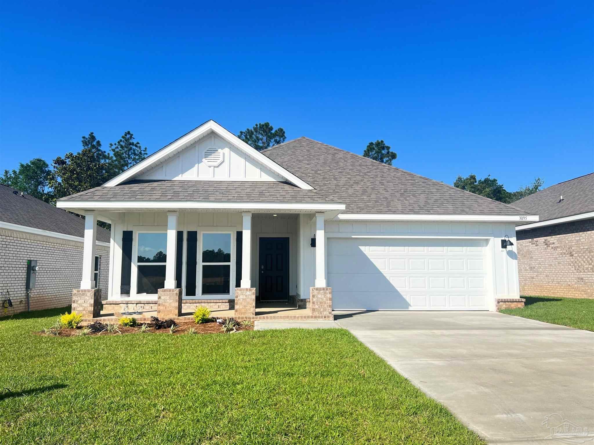 a view of a house with backyard porch and furniture
