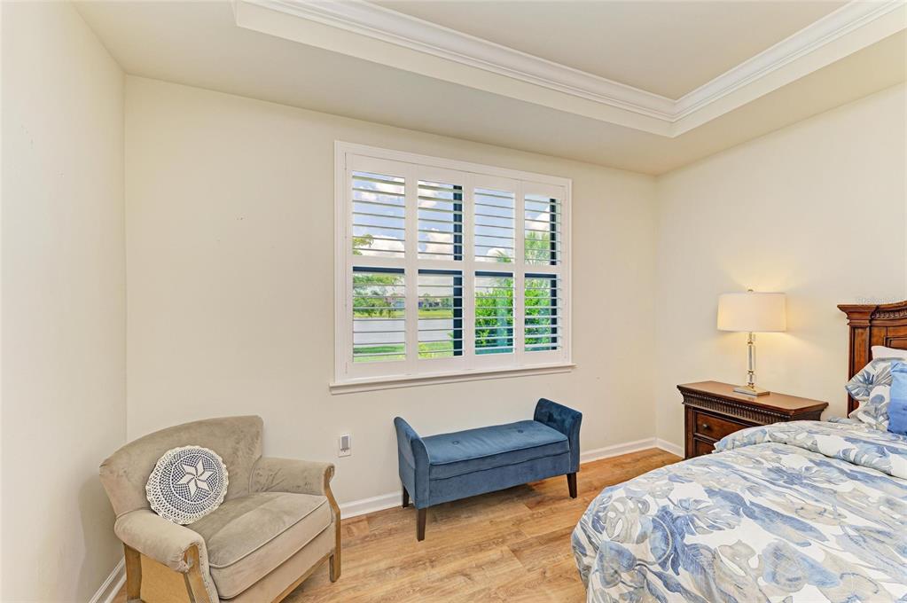 6756 Chester Trail Lakewood Ranch, FL 34202 - Photo 22 of 62 a bedroom with a bed and a couch