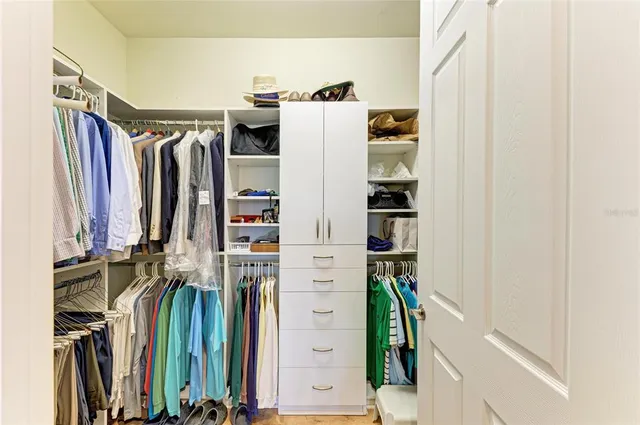 a bedroom with a bed and a lamp