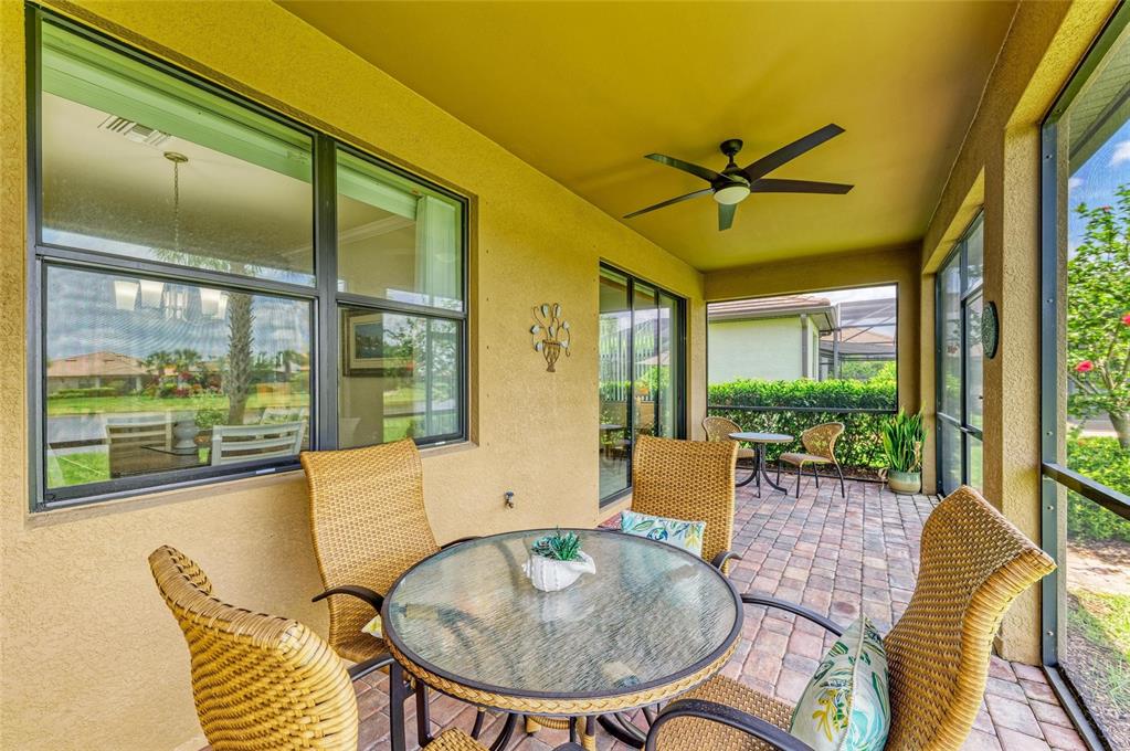 6756 Chester Trail Lakewood Ranch, FL 34202 - Photo 39 of 62 a balcony with table and chairs