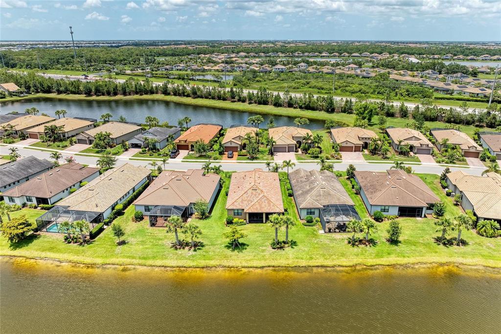6756 Chester Trail Lakewood Ranch, FL 34202 - Photo 45 of 62 an aerial view of residential house with outdoor space and lake view