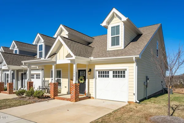 a front view of a house with parking