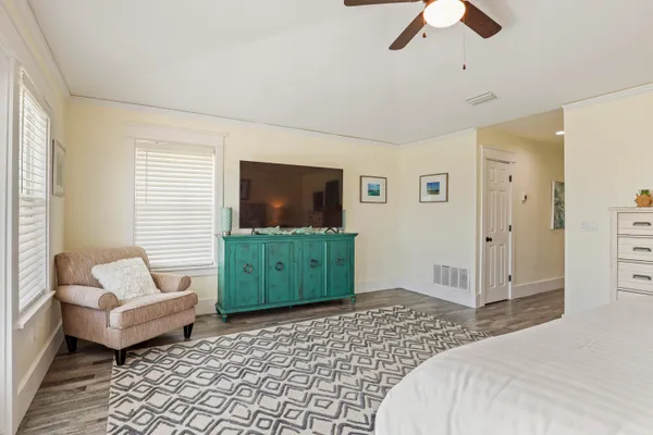 a bedroom with furniture and a window