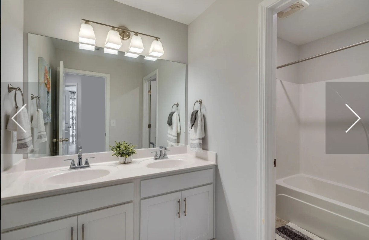 6161 Worthington Road Columbia, TN 38401 - Photo 26 of 33 a bathroom with a sink double vanity granite tub and a mirror