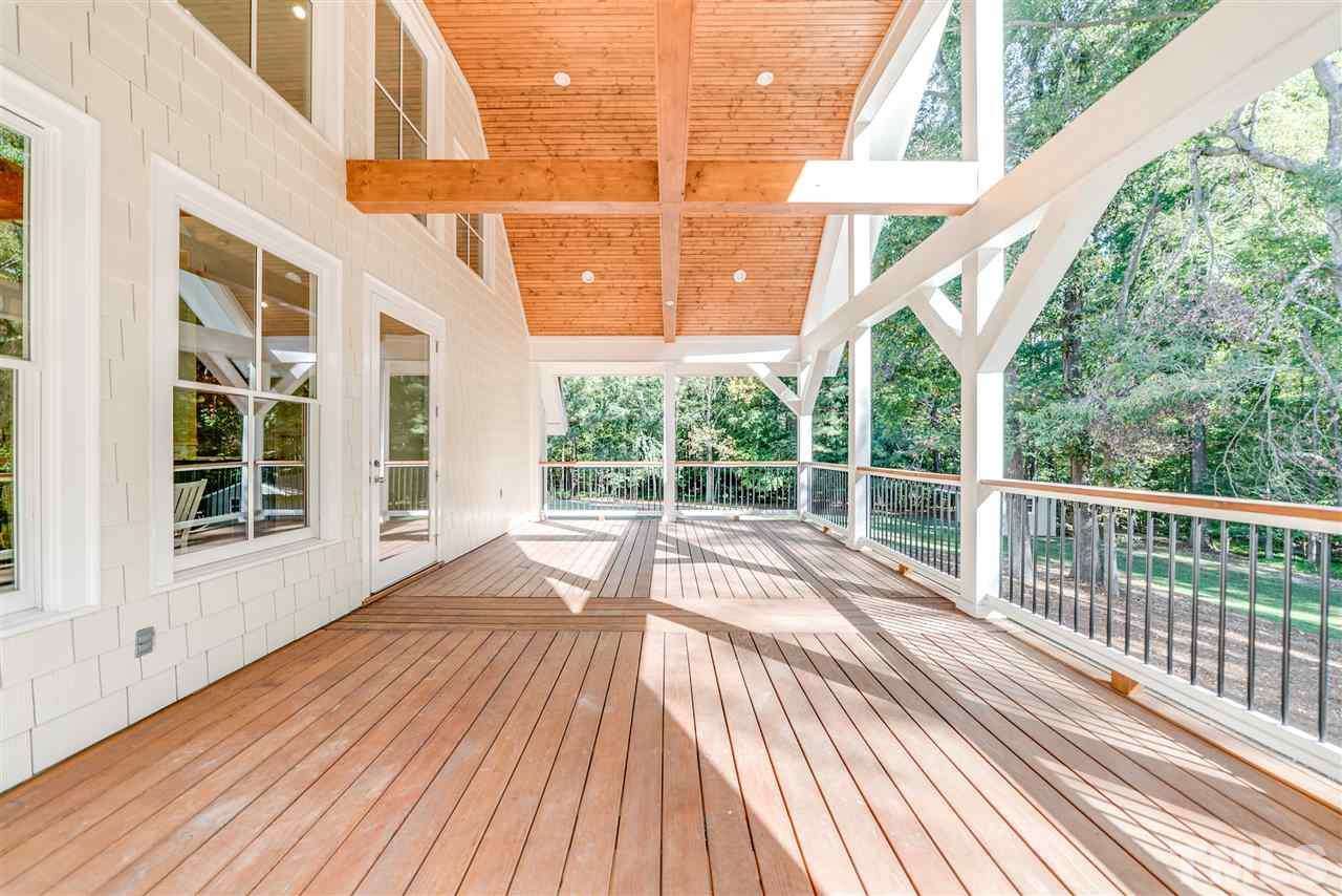 11908 Six Forks Road Raleigh, NC 27614 - Photo 22 of 25 a view of balcony with wooden floor and fence