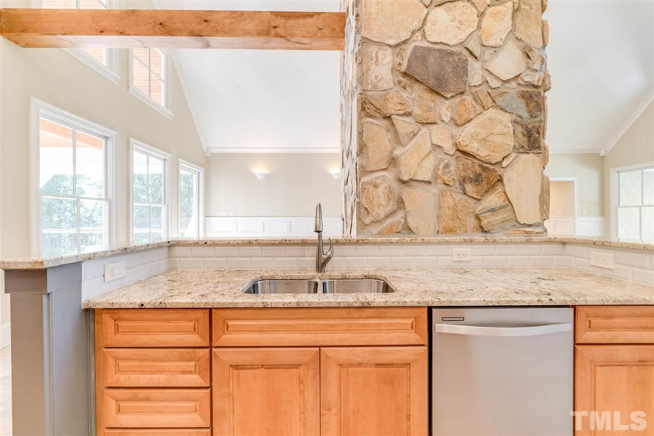 11908 Six Forks Road Raleigh, NC 27614 - Photo 8 of 25 a bathroom with a granite countertop sink and a window